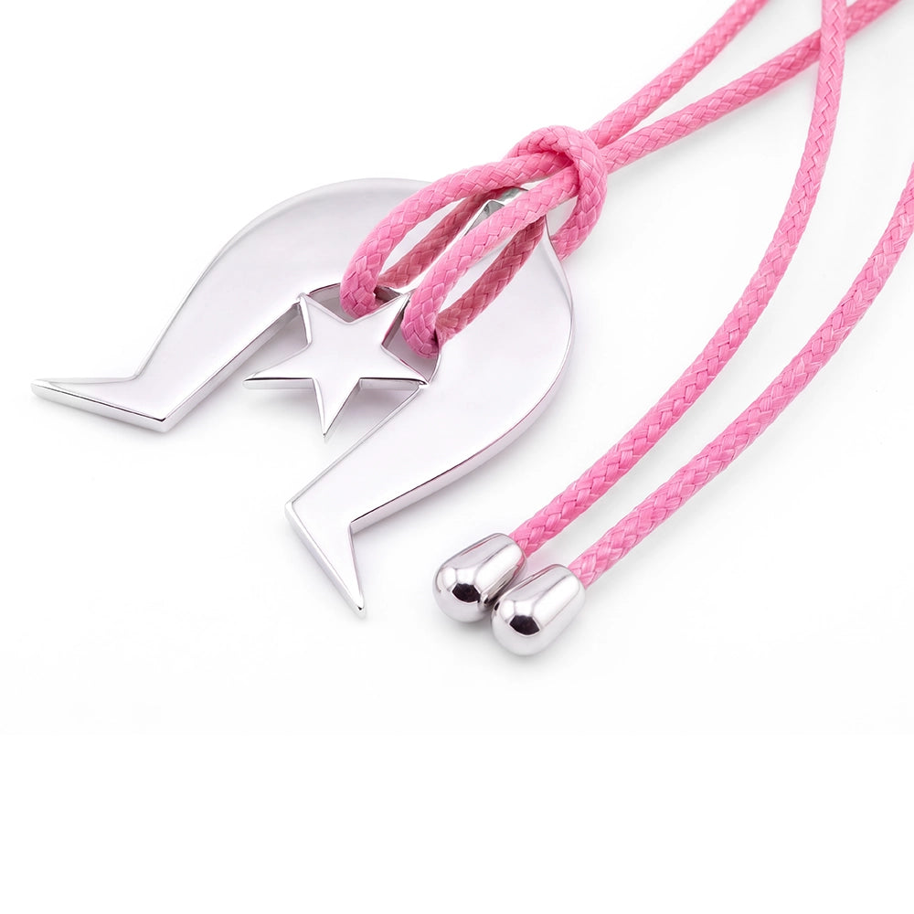 A silver Torres Strait Island Dhoeri Headdress, threaded through a pink braided cord necklace on a white background.