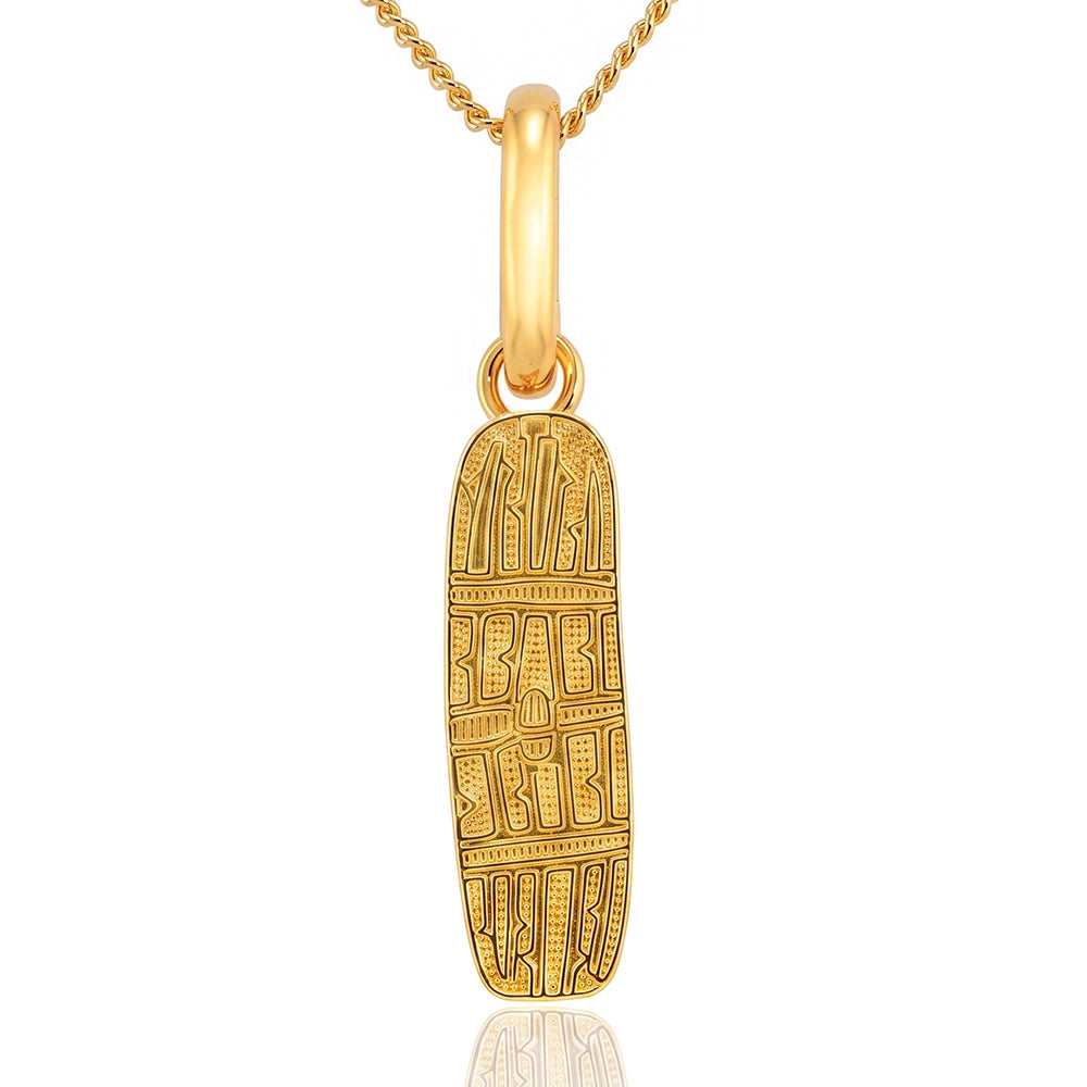 A gold pendant necklace featuring an engraved Traditional Aboriginal Shield, suspended from a gold chain on a white background with a subtle reflection.