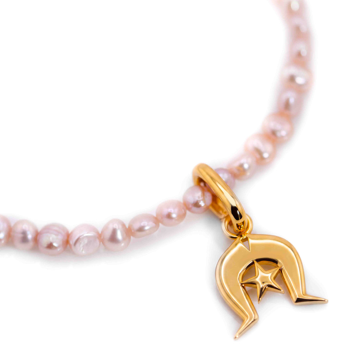 A close-up of a gold Dhoeri Headdress Pendant from the Torres Strait Islands featuring light pink freshwater pearls and a polished gold lobster clasp on a white background.
